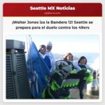 Walter Jones y Lofa Tatupu izan la Bandera 12 sobre la Space Needle antes del partido de los Seahawks